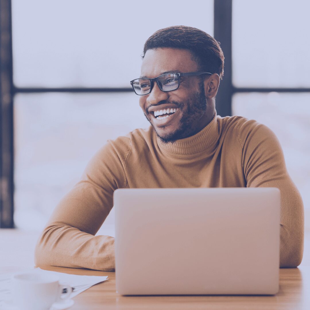 man smiling in meeting