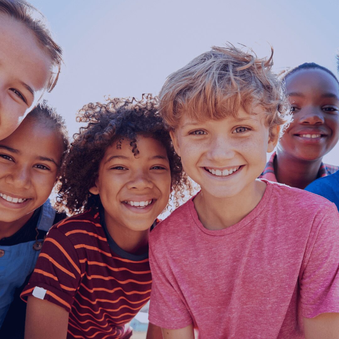 children smiling for a photo