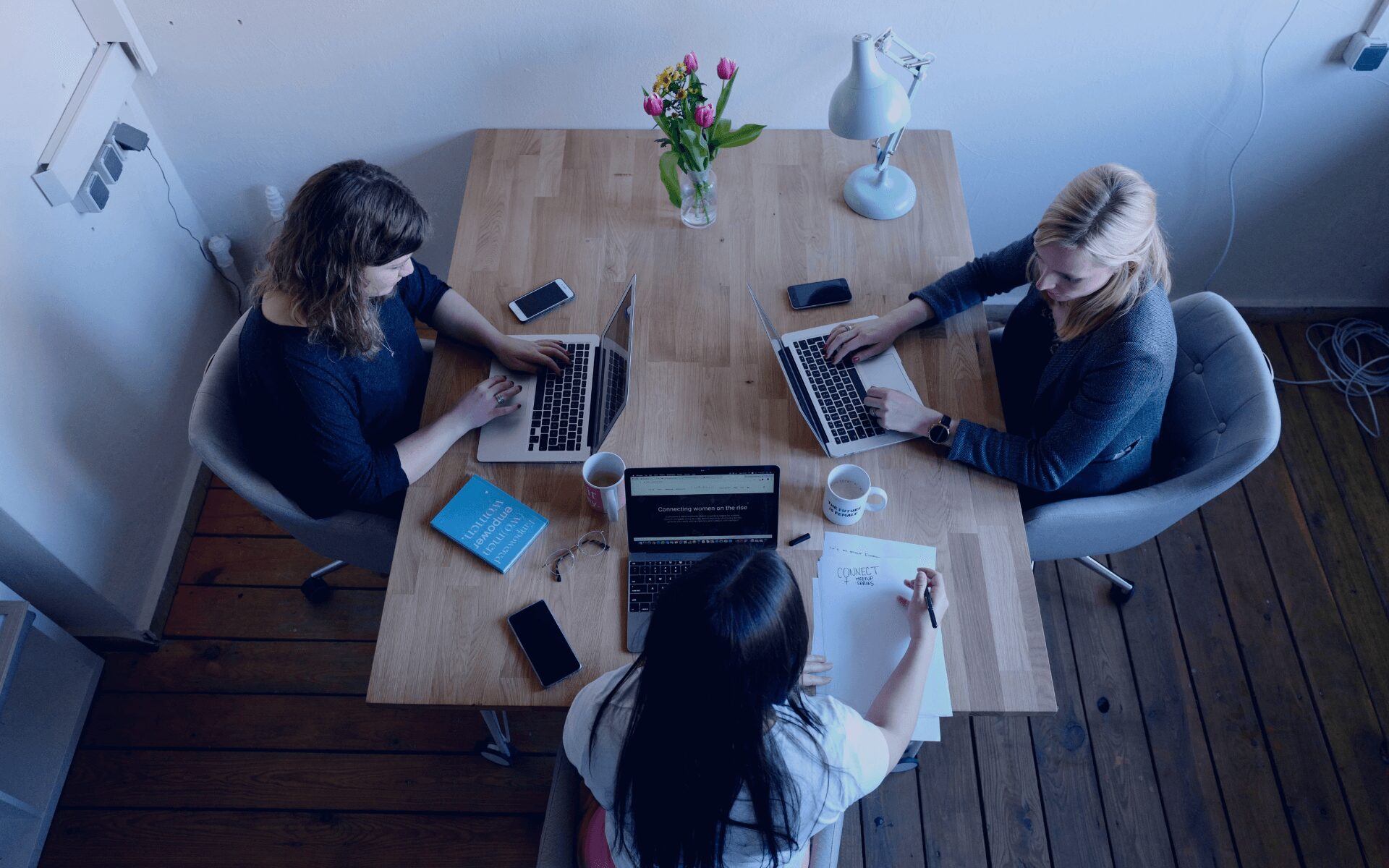 team meeting with three women on their laptops
