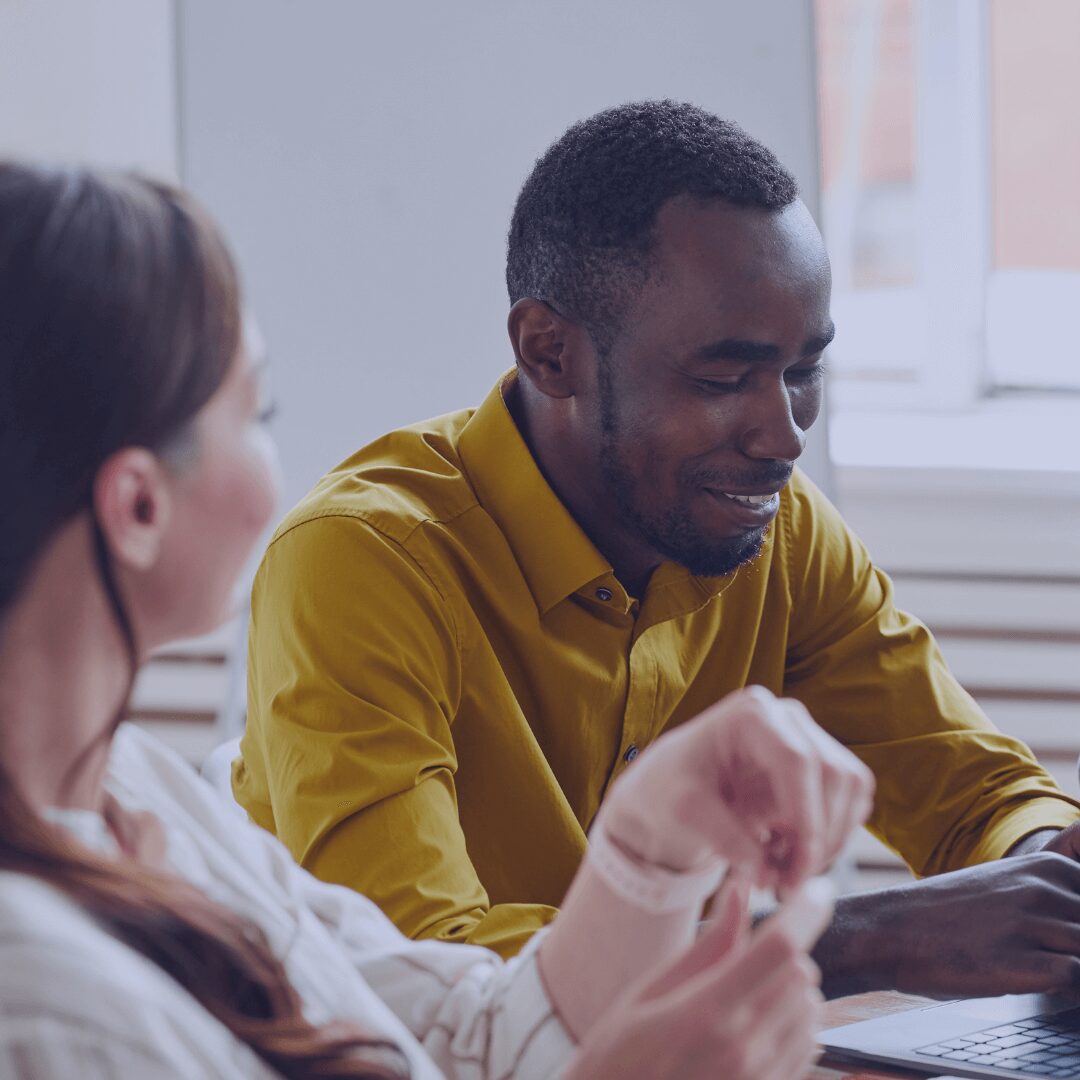 man smiling in meeting